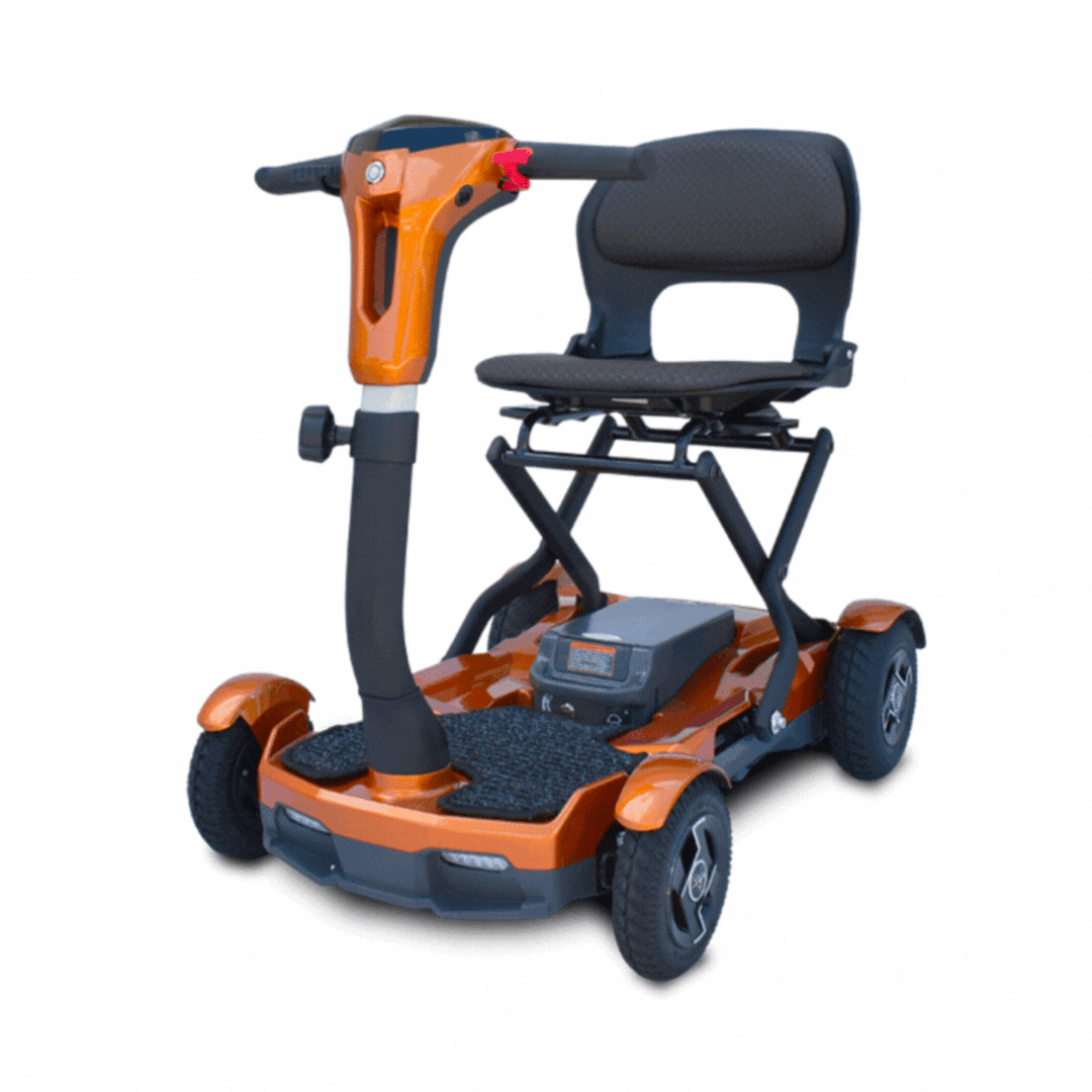 The EV Rider Teqno Automatic Folding Portable Travel Scooter is an orange, four-wheeled lightweight mobility scooter with a padded seat, armrests, and a tiller handlebar, shown against a white background.